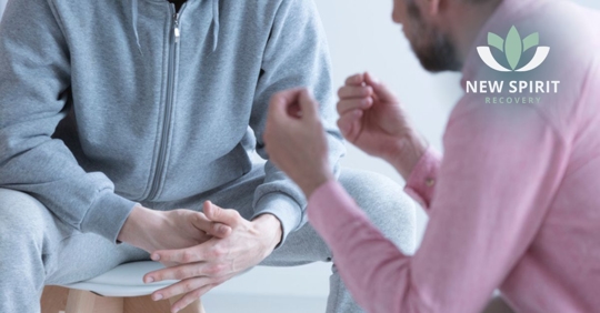 Professional man psychotherapist talking with rebellious teenager